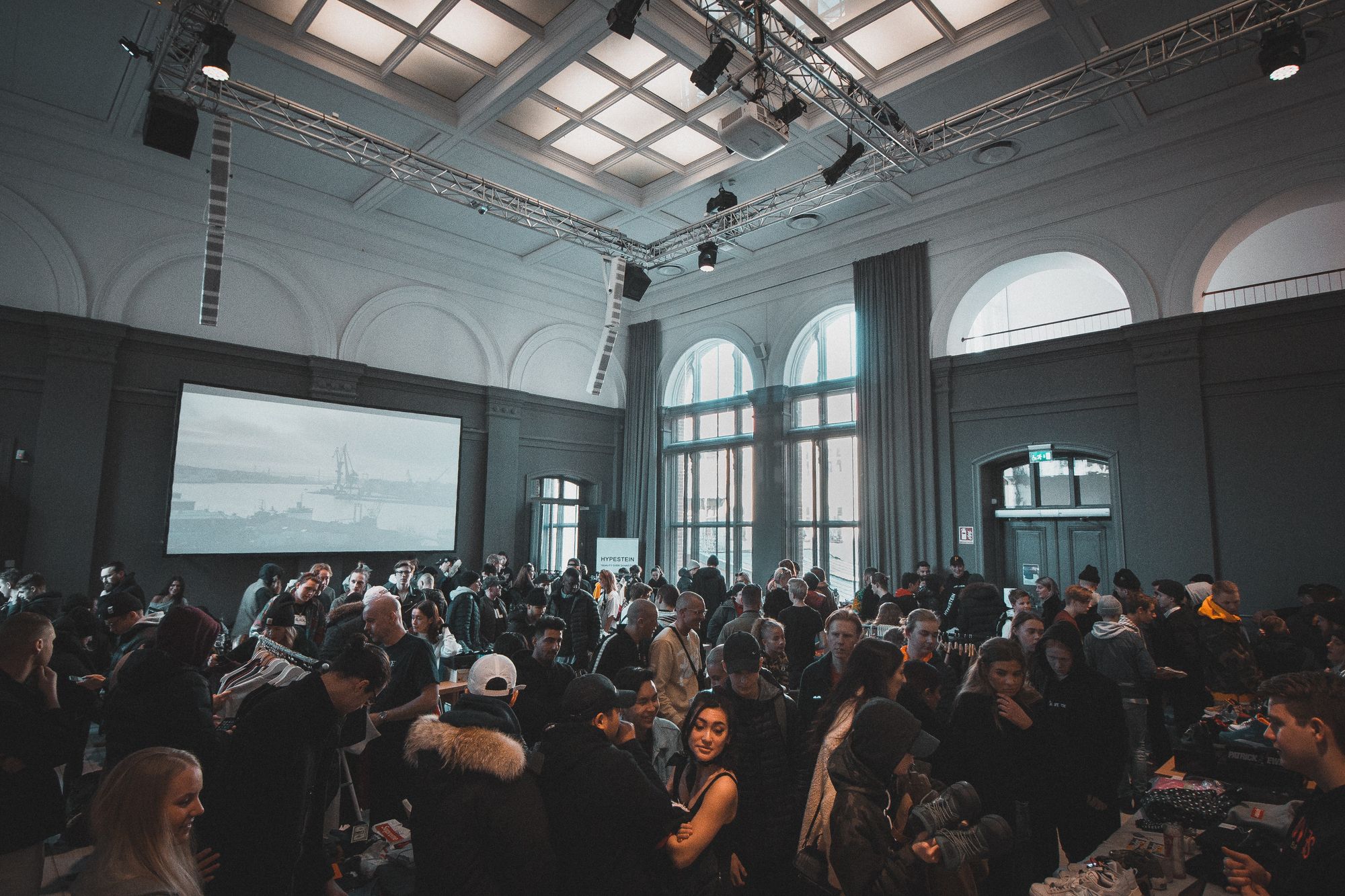 an event with people in a room watching a screen