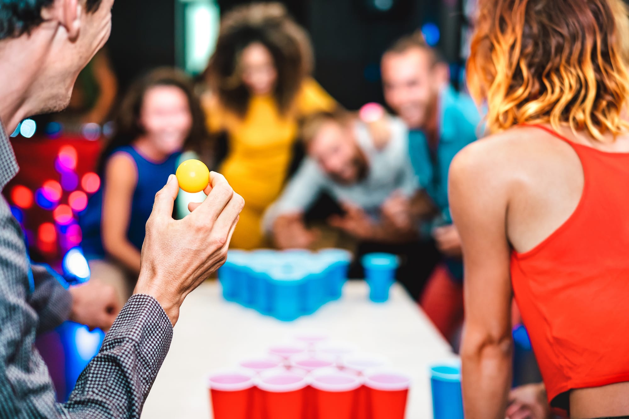 People playing beer pong