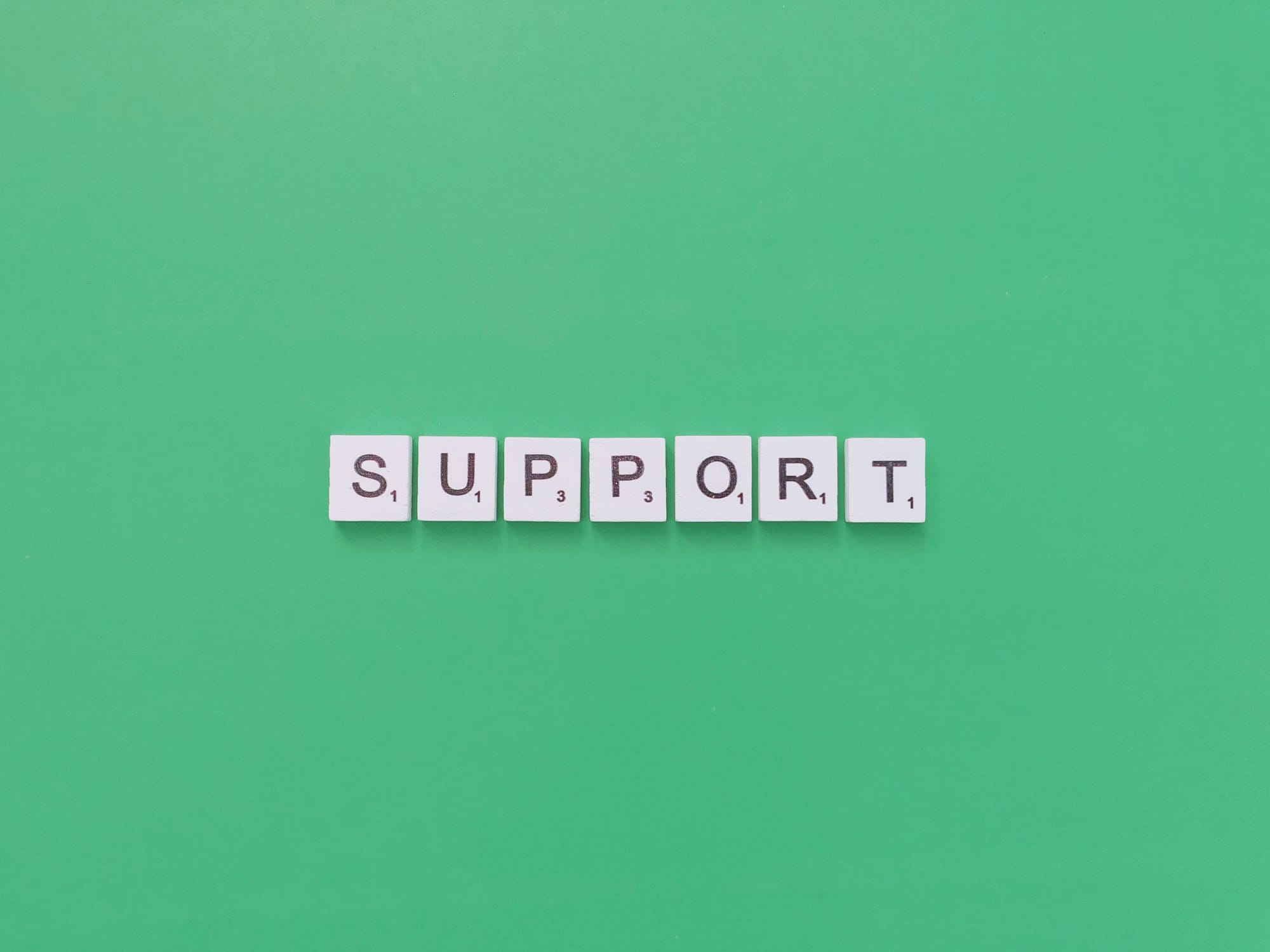 Word "Support" with green background