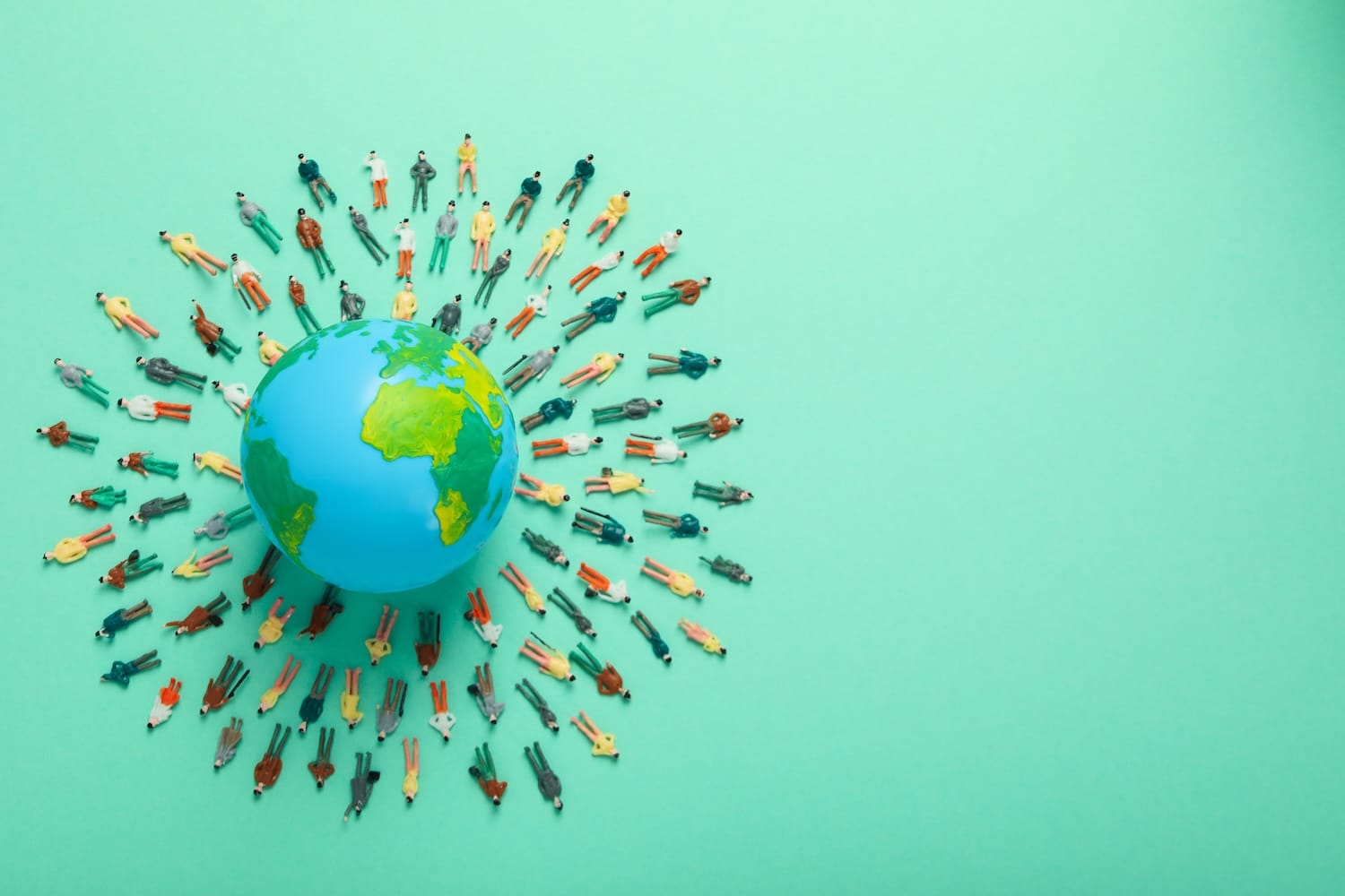 People figures surrounding earth on green background